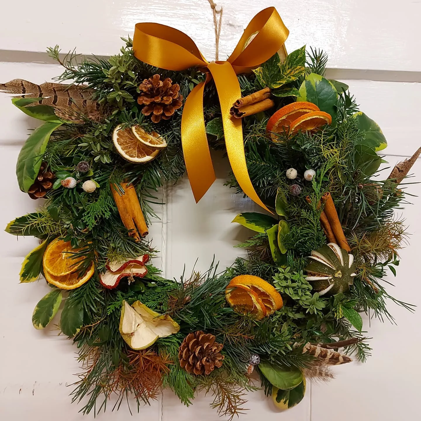 Festive flower arrangement handcrafted by Harriet